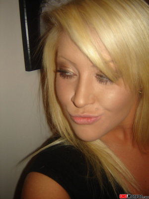 18 year old female Doris G slips off her underwear to pose naked on her bed